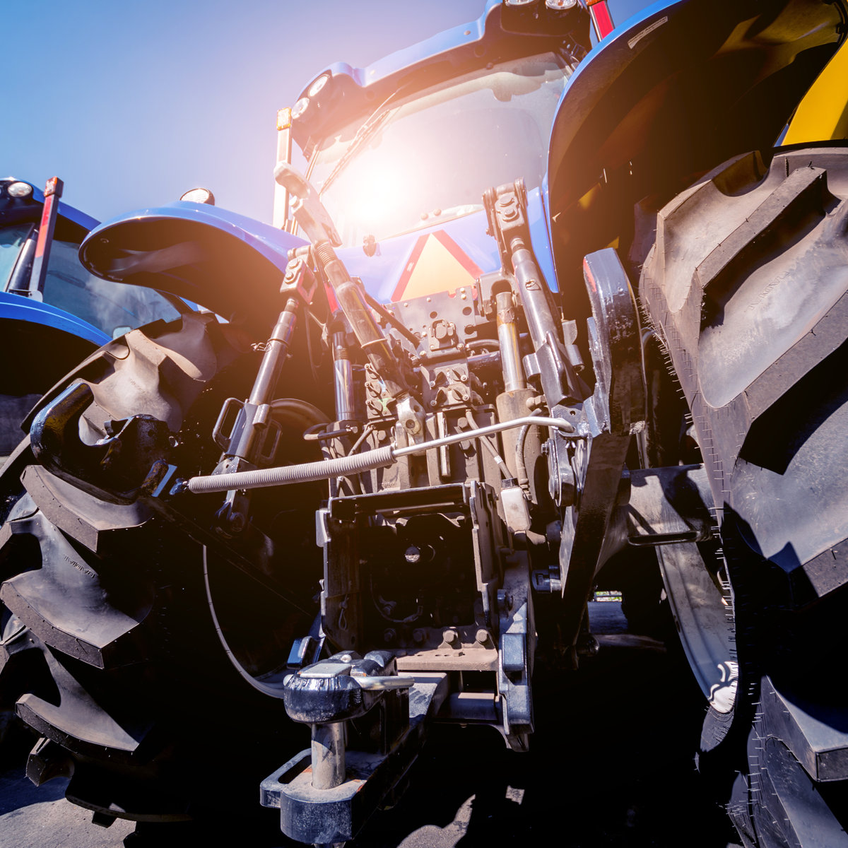 Rear view of modern agricultural tractor. Industrial details. Agricultural exhibition